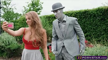 Busty chick fucks a living statue performer outdoors