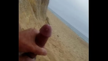 Beach masturbation with cumshot.