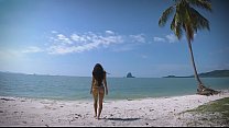 Micro bikini tease by sexy teen who walks on a beach