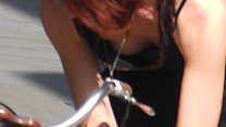 Redhead Bike Chick Bends Over to Show Me Her Tits