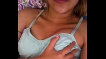 Pretty teen playing with her little tits.