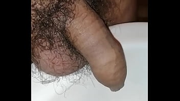 Playing with my foreskin when I pee and pull my cock