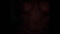 Naked woman dancing bachata in the dark