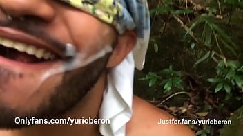 Fucking in the bush with bearded man taking cum in the face.