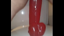Fat bitch takes a huge dildo in her pussy