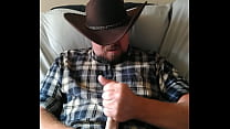 A COWBOY WORKING ON HIS LOAD