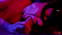 A masked woman sucks a big cock with an ending in her mouth a gentle blowjob in neon light to the music