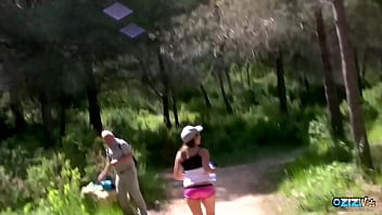 A cute runner takes a break to suck a huge cock in the forest