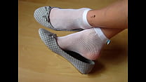 pointed ballet flats and fishnet socks, shoeplay by Isabelle-Sandrine